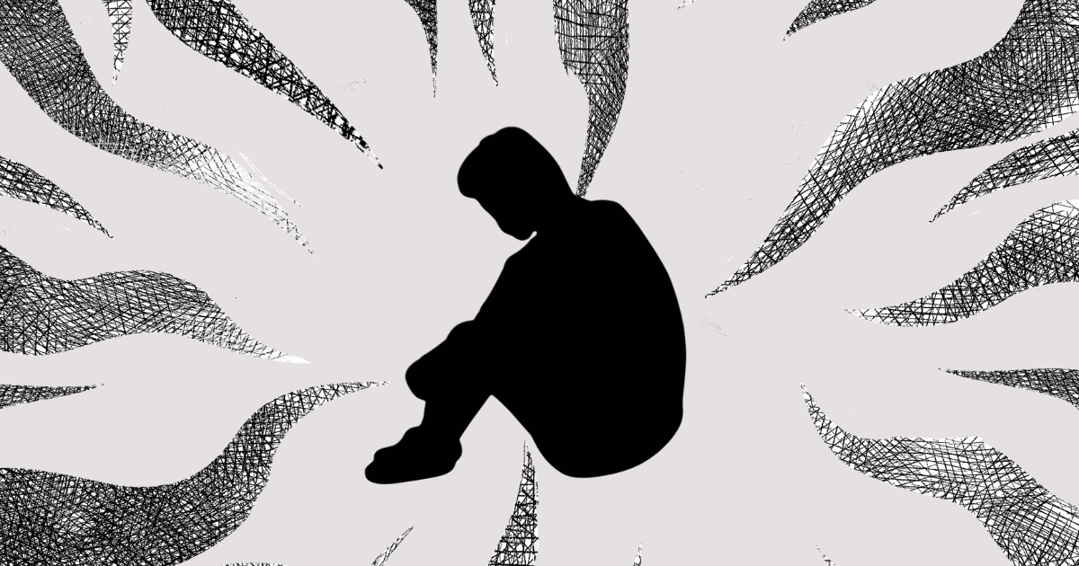 生きる意味に対する漠然な不安の渦にハマっている男性のシルエット